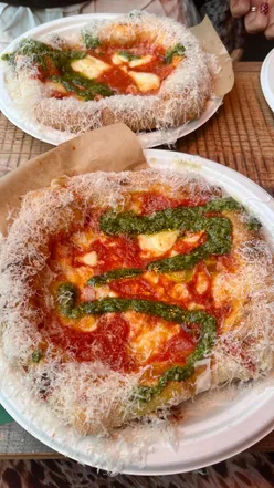 Group enjoying pizza and drinks at Botanical Garden Liverpool, celebrating the last days of summer.