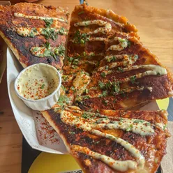 Delicious tacos and quesadillas from El Piloto in Manchester, featuring loaded fries for a tasty meal.