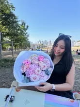 User sharing vibrant flowers and a longboard, capturing a joyful moment after recovering from a minor injury.
