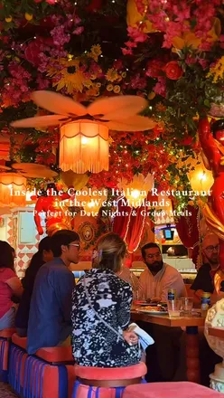 Trendy interior at Red Hot Mamma Pizzeria in Solihull, featuring vibrant decor, wood-fired pizzas, and colorful cocktails.