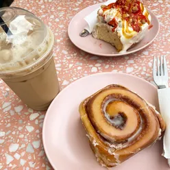 Breakfast date at Dublin bakery with cinnamon roll, iced chai, and strawberry caramel cheesecake roll.