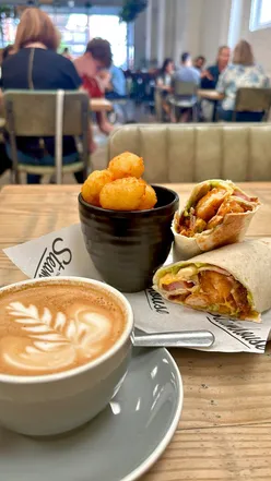 Delicious breakfast burrito and cinnamon bun at The Steam House Depot post-run brunch.