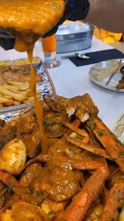 Seafood feast at SeaWorld Deansgate, featuring oysters, creamy mussels, linguine, salmon, and a seafood boil for two.