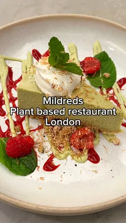 Delicious plant-based dishes at Mildreds in London: harissa bravas, masala aubergine, kiri hodi, and cheesecake.