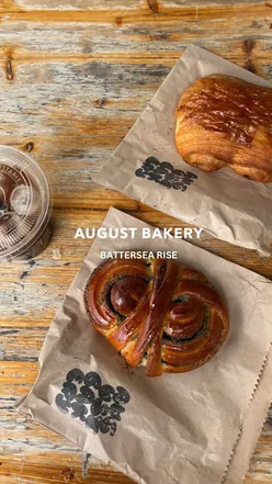 Patrons queuing at August Bakery on Battersea Rise for delicious pastries and treats on a busy Saturday morning.