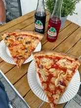 Delicious New York style pizza slices with garlic mushroom and buffalo chicken at Enjoy Pizza Society in Team Valley.