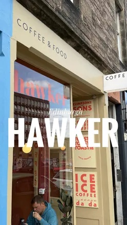 Enjoying coffee and pastries at Hawker Coffee, a trendy café in central Edinburgh with a vibrant atmosphere.