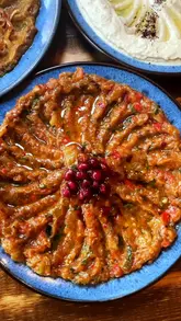 Delicious Mediterranean vegetarian dishes at Zest and Co restaurant in Leicester, featuring baba ghanoush, hummus, and pide.