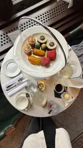 Magical afternoon tea at The Alice Oxford, featuring themed decor, fresh scones, and delightful 'drink me' mocktails.