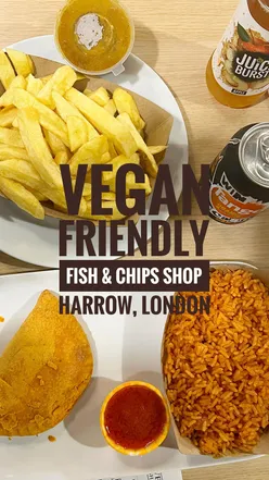 A delicious vegan meal at Every Fish Bar in Harrow with chips, curry sauce, Jamaican patty, and flavorful Jollof rice.