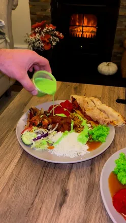 Delicious Indian food at Chilli So Uplands: kebab platter, chicken tikka masala, and coconut rice, all beautifully presented.