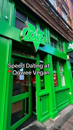 Delicious limited edition Impossible burgers at Oowee Vegan in Bristol, enjoyed with vibrant vegan food community.