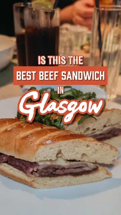 Delicious beef sandwich with gooey cheese and rich gravy at Trocadero in Crossbasket Castle, Glasgow's chic dining spot.