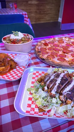 Delicious pepperoni pizza and sides at North End Pizzeria in Cupar, a must-visit eatery for pizza lovers.