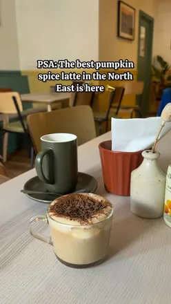 Enjoying a homemade pumpkin spice latte at @kithandkinwb, the perfect autumn brunch spot for cozy weekends.