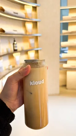 Delicious pastries and a Vanilla Iced Latte at Kloud Concept café in Merchant City, Glasgow, showcasing vibrant café culture.