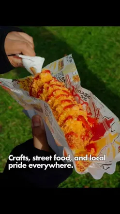 Colorful boats and vibrant crowds at Black Country Boating Festival, featuring crafts, street food, and canal tours.