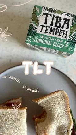 High-protein Tiba Tempeh sandwich with lettuce and tomato, perfect for a quick, tasty vegan lunch option.