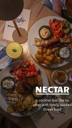 Cozy cocktail bar in Edinburgh serving homemade Greek food with stunning cocktails and friendly service in a quaint garden setting.