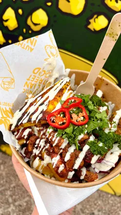 Delicious Indian rolls and bowls at Kool Kata Street Food in Longbridge, Birmingham, featuring tandoori chicken and flavorful toppings.