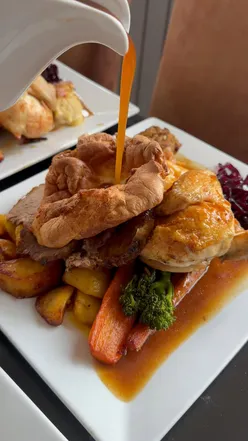 Divine Sunday roast featuring beef, gammon, and chicken at The Fox and Hounds, Fair Oak, perfect for cozy dining.