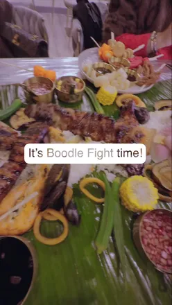 “Celebrating Boodle Fight with friends at D Cocina Birmingham, enjoying Filipino food and vibrant atmosphere.