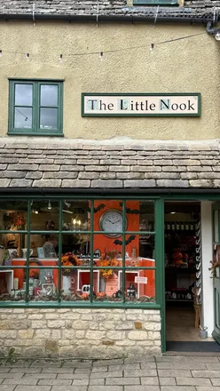 'Enchanting autumn scene in Bourton on the Water, Cotswolds with fairy-tale vibes and picturesque landscapes.'