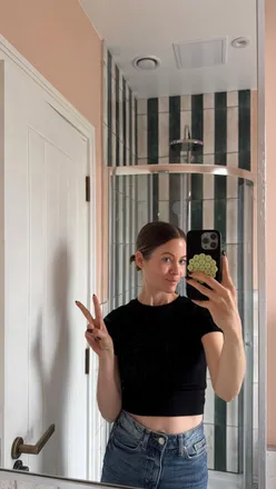 Bathroom renovation featuring striped tiles and terracotta walls, showcasing hard work and dedication in London.