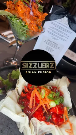Guests enjoying flavorful dishes and drinks at the new Sizzlerz restaurant on London Road, Leicester.