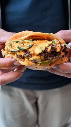 Delicious beef burger and chicken sando from Dark Burg in Park Royal, London, highlighting halal takeaway options.
