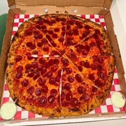 Delicious whole pizza from Bambino in Dublin, perfect for sharing after a day of exploring.