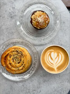 New Lebanese bakery in London showcasing savory pastries and unique banana bread topped with tahini frosting.
