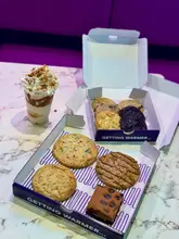 Delicious assortment of cookies and a cookie shake from Insomnia Cookies in Birmingham City Centre, perfect for sweet lovers!