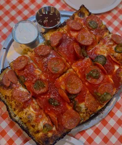 Delicious Detroit pizza and golden chicken tenders at Sub Rosa in Glasgow, a hidden gem for food lovers!