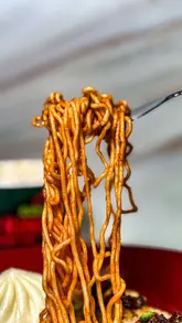 Bibigo Spicy Kimchi Ramyun with instructions and flavor rankings, showcasing delicious instant noodle options.