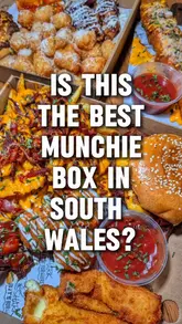 Delicious munchie box featuring burgers, loaded fries, BBQ wings, and milkshake from Shark Bite Burgers in Cwmbran.