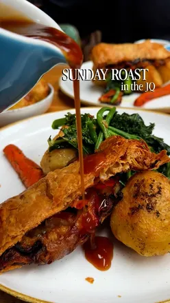 Vegan Sunday roast with vegetable wellington, roasties, carrots, and greens at The Rolling Mill in Birmingham's JQ.