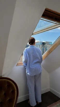 Person reflecting on the lucky moments of life, surrounded by everyday beauty and dreams of home.