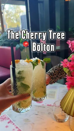 Enjoying wood-fired pizzas and cocktails at The Cherry Tree, a charming Bolton spot perfect for gatherings and date nights.