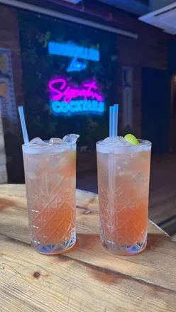 Enjoying cocktails at Liverpool Cocktail Week, featuring Mango Diablo at The Alchemist and more festive drinks.