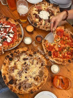 Sambrooks Brewery taproom in Battersea, London, under Wandsworth's Victorian chimney; craft beer, terrace, and pizza.