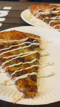 Delicious pizza varieties at Pitfire Slice Bar, Granby Street, Leicester, showcasing NYC-inspired flavors and halal options.