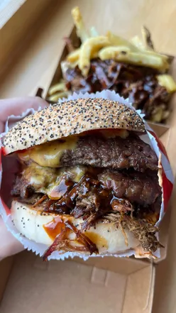 Delicious pulled rib cheeseburger and loaded pit boss fries at Meat Stack UK, perfect for gluten-free diners!