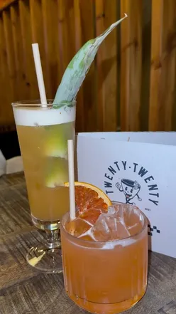 Varied cocktail menu and 20" pizzas at Twenty Twenty in Newcastle, featuring sweet drinks and hot honey drizzle.