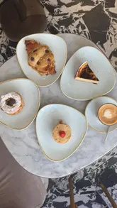 Delectable French pastries including Paris Brest, vanilla flan, crookie, and fraisier at Philippe Conticini in South Kensington.