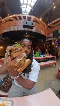 Enjoying the new Garlic Palm Sandwich at Must Be Lucky's in Seven Dials Market, London, with friends.