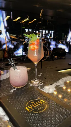 Couple enjoying a lively date night at One Eight Six in Manchester, vibrant atmosphere and fun vibes.