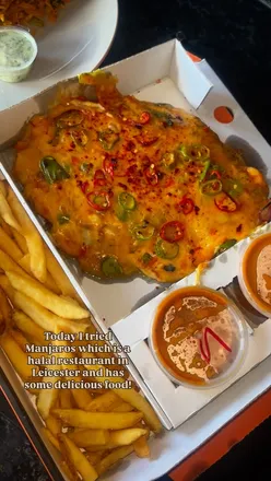 Delicious halal meal from Manjaros Leicester featuring grilled chicken, Rasta rice, and Hot Shot Parmesan delivered fresh.
