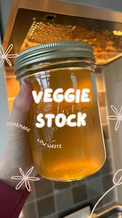 'Homemade vegetable stock made from scraps in a large container, perfect for low-waste cooking and meal prepping.'
