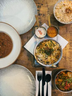 Delicious dinner at Black Cumin in Bristol featuring tandoori dishes, gluten-free options, and a flavorful mango lassi.